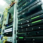 High-tech server rack in a secure data center with network cables and hardware components.